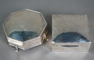 An octagonal silver cufflink box with cream watered silk and blue velvet lining, on winged pad feet,