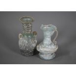 Two small Roman glass two-handled vessels, 11 and 9 cm high