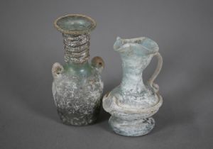 Two small Roman glass two-handled vessels, 11 and 9 cm high