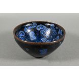 A Chinese Song style jianyao bowl with thick unctuous black and blue streaked opaque glaze