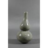 A Chinese Ge ware style double gourd vase, the pale grey glaze with networks of darker grey crackles