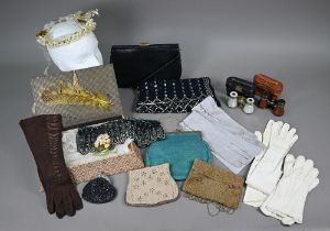 A collection of vintage evening purses and bags, some beaded, one silk covered; a beaded and