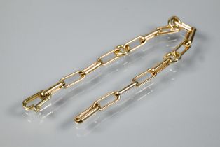 Loquets of London - a 14ct yellow gold bracelet formed of clip and round links, with concealed