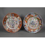 Two 18th century Chinese blue and white polychrome clobbered plates, painted with dragons and floral