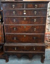 A late 17th/18th century oak chest on stand, the two short over four long graduated drawers with