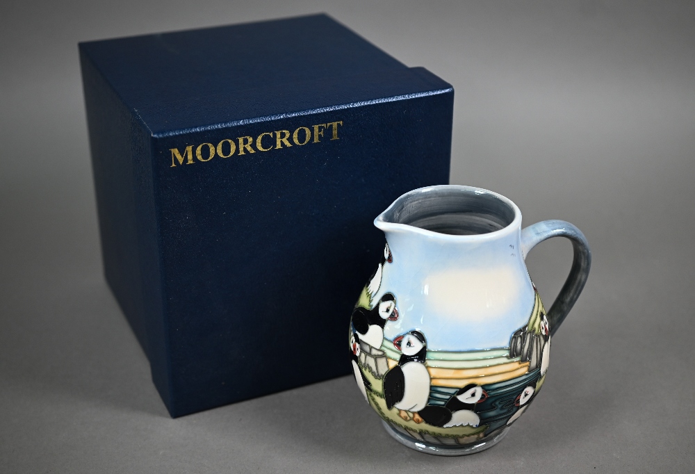 A boxed Moorcroft 'Puffins' jug by Carol Lovett, 14 cm