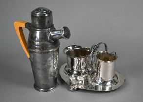 An Art Deco epns cocktail shaker with composite handle 23cm, to/w an Edwardian Art Nouveau cream and