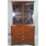 A George III mahogany secretaire bookcase, the dentil moulded cornice over a pair of astragal glazed