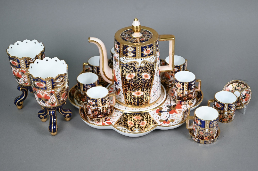 A Victorian Davenport Imari pattern coffee pot and nine coffee cans and saucers on a fitted tray