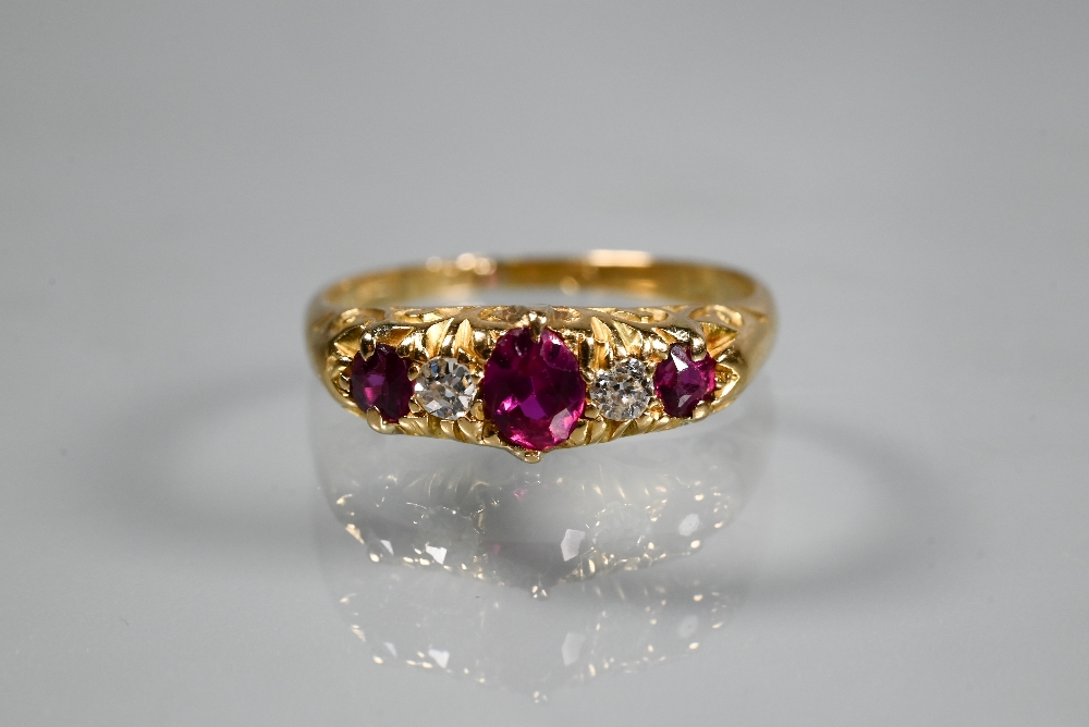 An antique five stone ruby and diamond ring, the graduated stones in 18ct yellow gold setting,