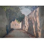 G Lorni? - A continental view of a shady street with figure, oil on board, signed, 23 x 31.5 cm