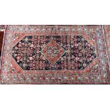 An old North West Persian Mahal rug, the blue ground with centre medallion in red, 200 cm x 125 cm