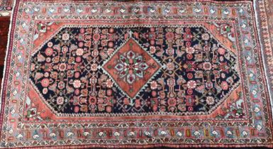 An old North West Persian Mahal rug, the blue ground with centre medallion in red, 200 cm x 125 cm