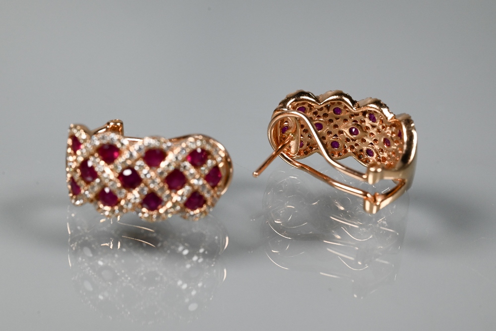 A ring and earring suite stamped 'Royal', with ruby and diamond lattice-work design, rose metal - Image 6 of 6
