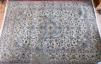 A contemporary central Persian Kashan carpet, the pale jade and camel ground with stylised floral
