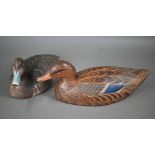 A 19th century US painted hollow wood duck decoy, stamped 'Jo Bedar' 43 cm long, to/w a solid wood