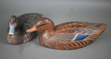 A 19th century US painted hollow wood duck decoy, stamped 'Jo Bedar' 43 cm long, to/w a solid wood