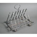 A Victorian Elkington & Co electroplated folding toast rack of triangular form, with hinged loop