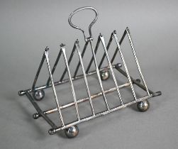 A Victorian Elkington & Co electroplated folding toast rack of triangular form, with hinged loop