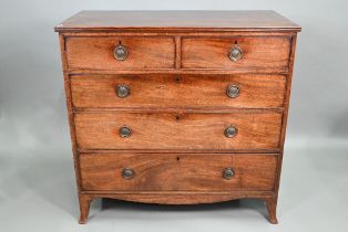 A Georgian mahogany chest of two short over three long graduated drawers, raised on splay bracket