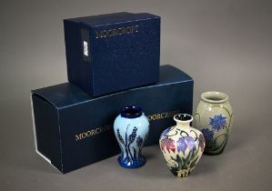 Three boxed small Moorcroft vases, 'Alpine Meadow' 10 cm; 'Wild Cornflowers' 10 cm; and 'Muscari' 10