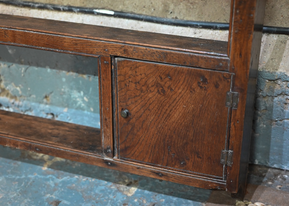 An antique oak delft rack, with two small cupboard doors and open back, 143 cm w x 14 cm x 102 cm h - Image 3 of 7