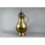 An antique Persian brass water carrier with hinged cover and loop handle, decorative horizontal