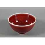 A Chinese Lang Yao/sang-de-boeuf bowl, covered with a rich copper red glaze, contrasting white rim