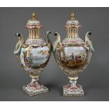 A pair of 19th century French porcelain vases, the domed covers with fir-cone finials, the twin