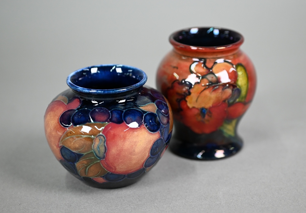 A vintage Moorcroft small baluster vase, decorated with 'orchid' pattern on flambé ground, 8 cm to/w