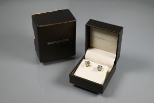 A pair of diamond stud earrings for pierced ears, the round brilliant cut diamond in collet setting,