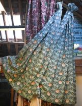 A pair of curtains in William Morris's Tulip design with triple pleat headings, fully lined and