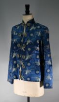 A Chinese navy blue silk mandarin-style jacket with shaped collar and buttons to front, sheepskin-