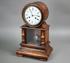 A Victorian mahogany drum cased mantel clock, the eight day two train movement striking on a bell,
