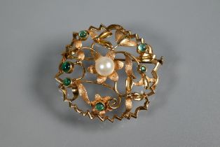 A circular brooch of open floral form, set with central cultured pearl and with six small cabochon