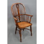 An antique elm seat high splat back Windsor chair, Lincolnshire, with crinoline stretcher