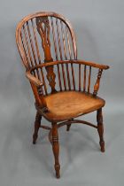 An antique elm seat high splat back Windsor chair, Lincolnshire, with crinoline stretcher