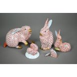 Two Herend (Hungary) red scale rabbits, 11 x 13 cm /14 cm high to/w two small groups of two