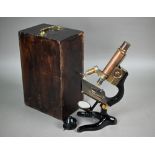 A boxed E Leitz (Wetzlar) microscope no 158012 to/w a C Baker (London) lens