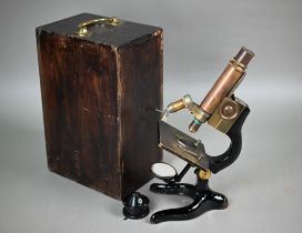 A boxed E Leitz (Wetzlar) microscope no 158012 to/w a C Baker (London) lens