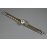 A Tudor 9ct gold ladies wrist watch, champagne dial (approx. 17.1g)