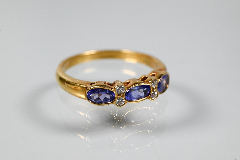 An 18ct yellow gold ring set with three oval blue sapphires with two diamonds between, size P to/w a - Image 5 of 6