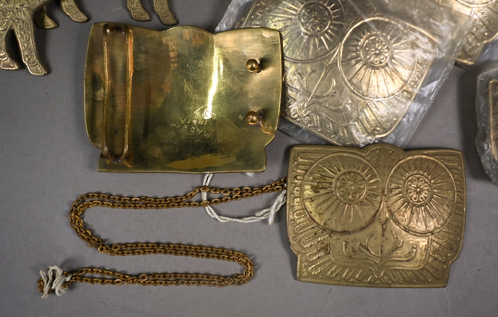 A collection of twenty Indian cast brass buckles, some in the form of standing rams, some with - Image 3 of 6