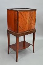 An Edwardian mahogany cellarette / drinks cabinet, of slender bowfront form, the single door