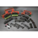 A US Lionel Corporation 0 Gauge electric 2-4-2 locomotive with tender to/w two Pullman coaches and