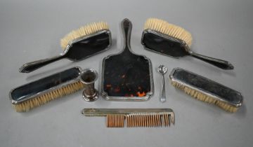A silver and tortoiseshell five-piece brush set, to/w a silver mounted comb, a small vase and a