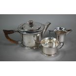 An Indian Colonial silver three-piece bachelor tea service in the Arts and Crafts manner, with