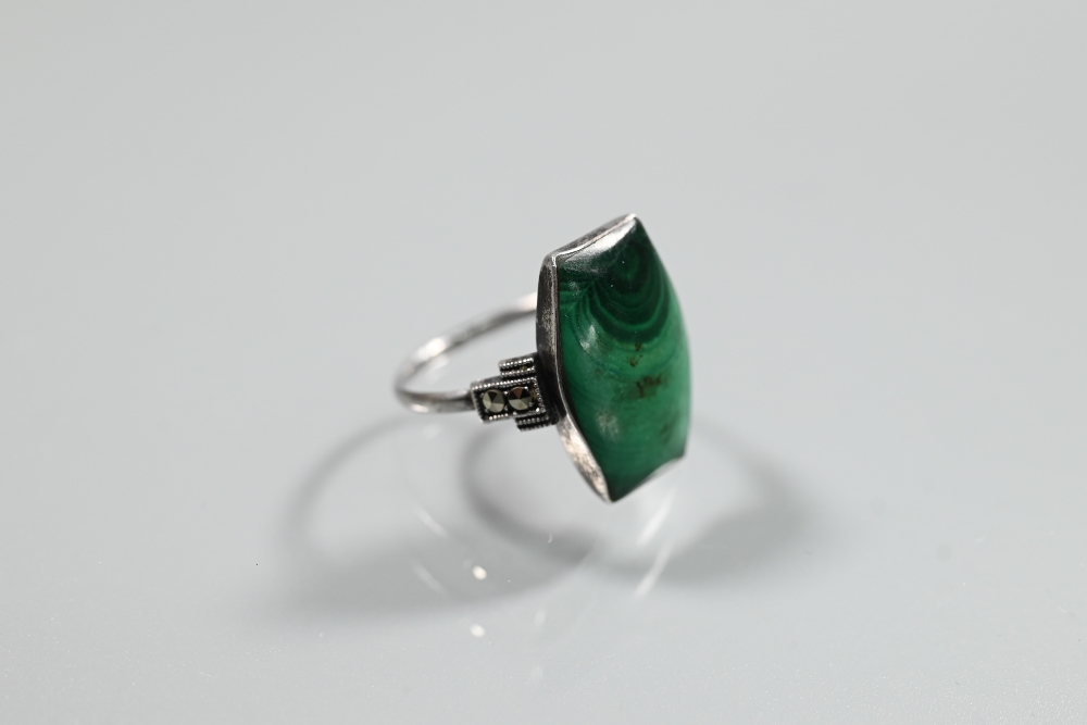 An Art Deco style silver, malachite and cubic zirconia set cocktail ring, size P