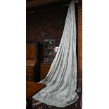 A pair of long country house curtains in pale grey with stylised acanthus leaf decoration, triple