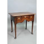 An 18th century oak three drawer side table, raised on turned legs to pad feet, 76 cm w x 51 cm x 71